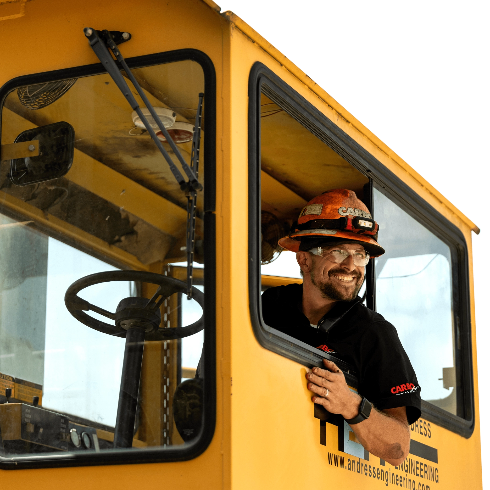 Worker in helmet driving machine