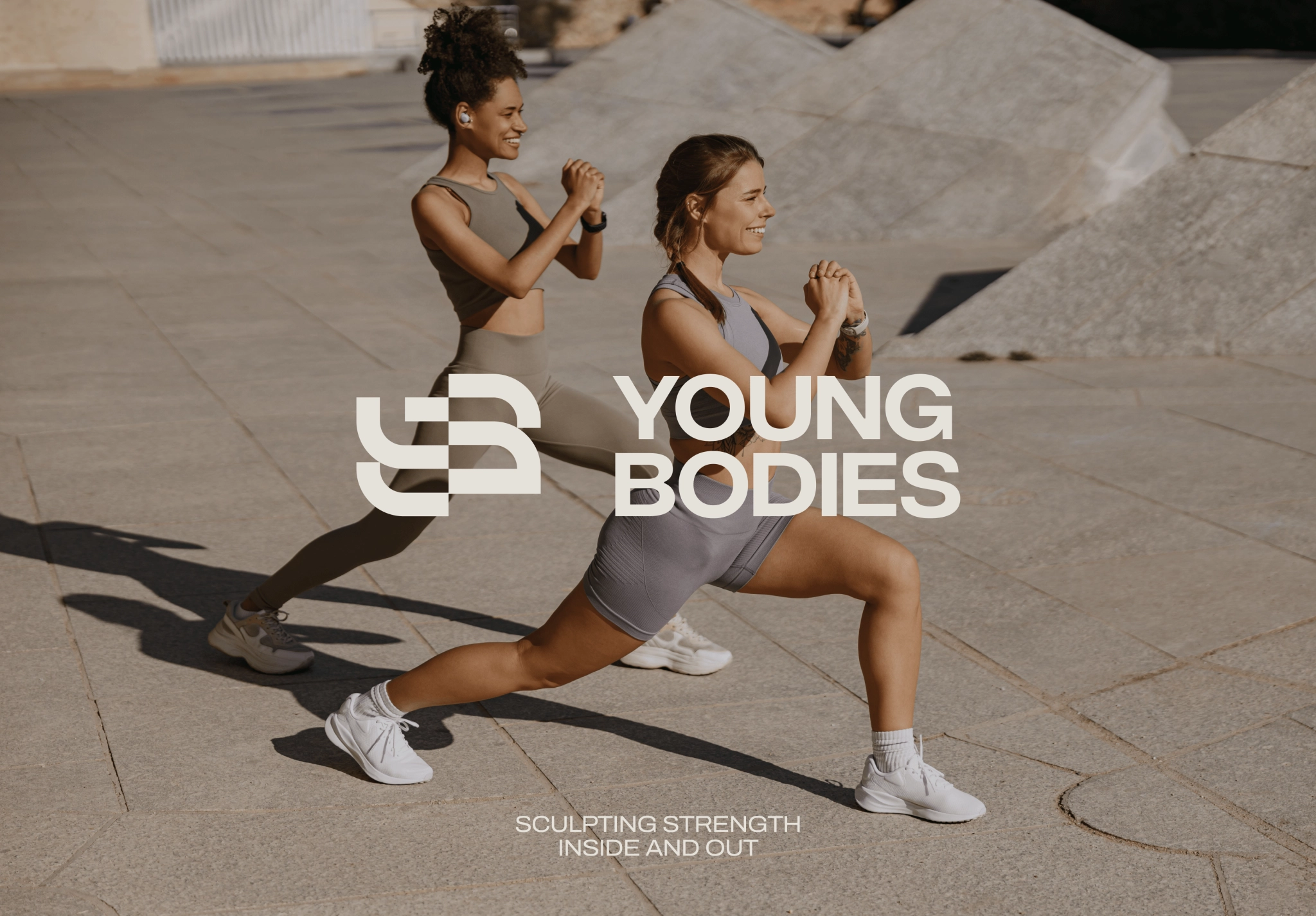 Two women doing lunges outdoors