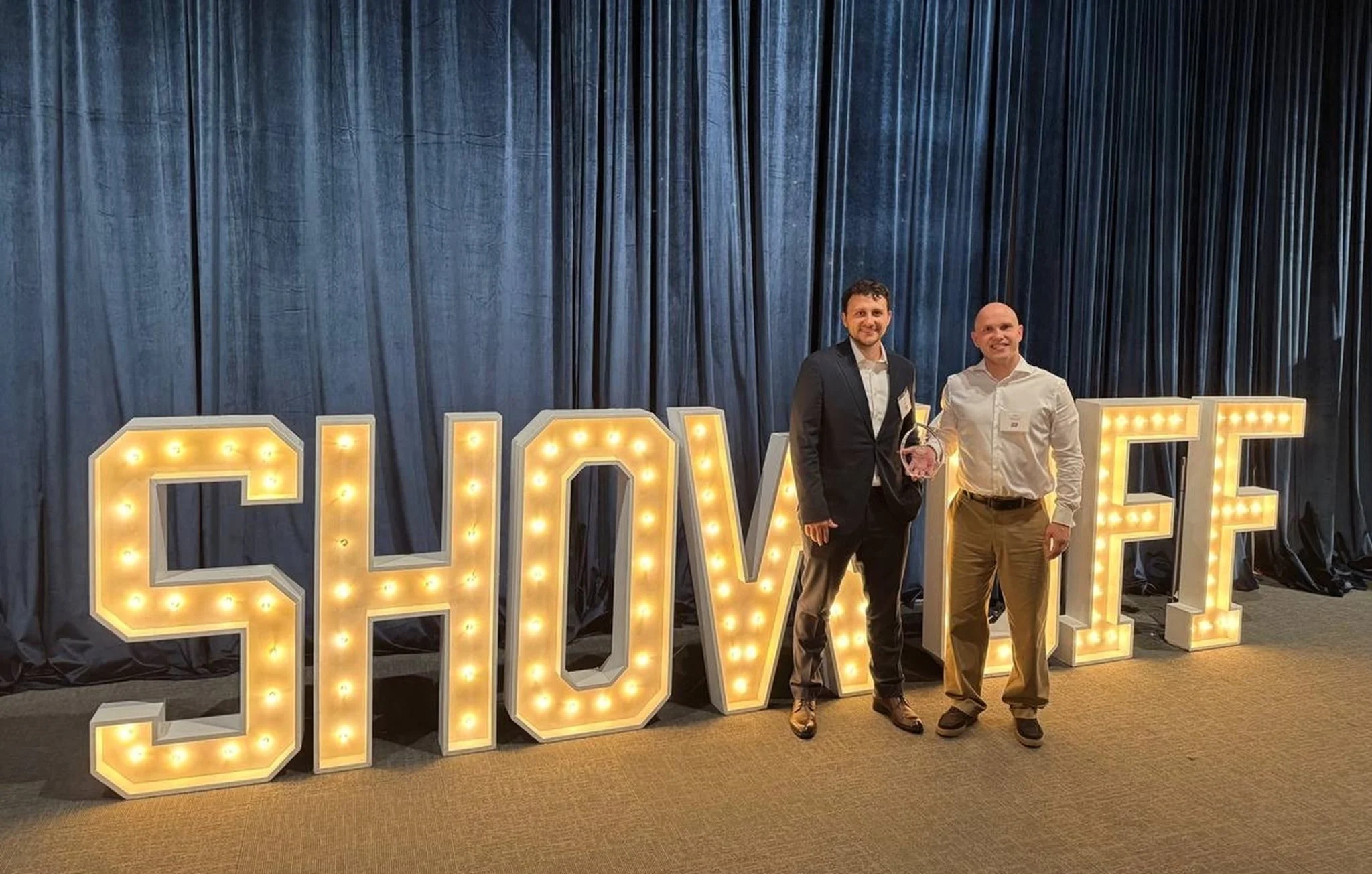 Two men at award event